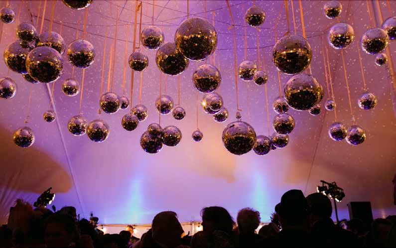 Immersive ceiling installation with suspended reflective spheres